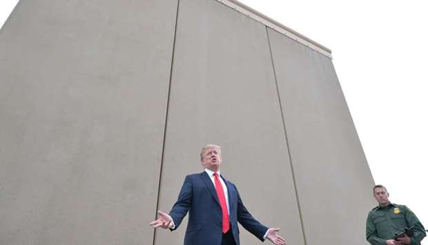 US President Donald Trump inspects border wall prototypes with Chief Patrol Agent Rodney S. Scott in San Diego, California. March 13, 2018 file picture