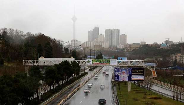 Drivers on a wet road during a rainy day in the Iranian capital Tehran