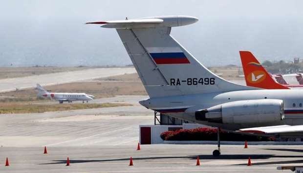 An airplane with the Russian flag is seen at Simon Bolivar International Airport in Caracas, Venezuela on Sunday.