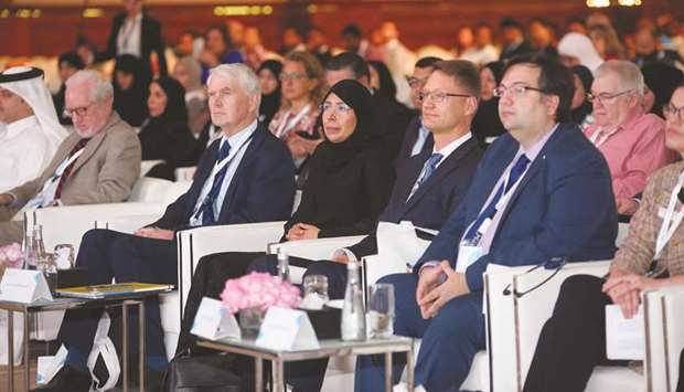HE the Minister of Public Health Dr Hanan Mohamed al-Kuwari with other dignitaries at the opening session of the conference.