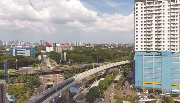 A Jakarta Mass Rapid Transit (MRT) train travels along an elevated track in this aerial photograph taken in Jakarta (file). The money raised through sukuk sale will used for funding infrastructure projects, which will be undertaken by various ministries.