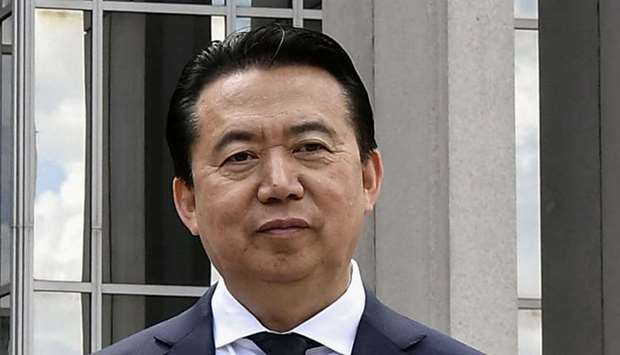 Meng Hongwei poses during a visit to the headquarters of International Police Organisation in Lyon, France on May 8, 2018.
