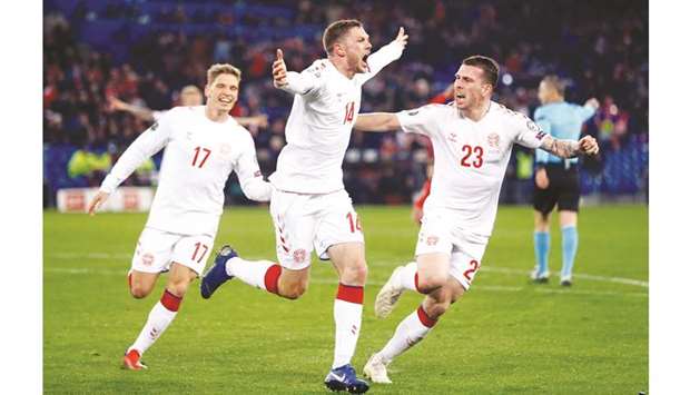 Denmarku2019s Henrik Dalsgaard (centre) celebrates after scoring against Switzerland in the Euro 2020 qualifying Group D match in Basel, Switzerland. (Reuters)