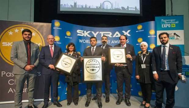 HIA chief operating officer engineer Badr Mohamed al-Meer and the executive management team with the Skytrax awards in London on Wednesday.