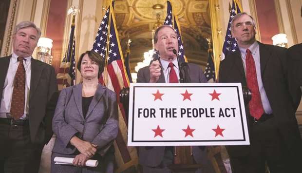 (From left) Senators Sheldon Whitehouse (D-RI), Amy Klobuchar (D-MN), Jeff Merkley (D-OR) and Tom Udall (D-NM) hold a press conference to unveil the u2018For The People Actu2019 at the US Capitol in Washington, DC. Originally introduced in the House of Representatives by House Democrats, Senate Democrats are now drafting companion legislation that seeks to expand voting rights, limit gerrymandering, and limit the influence of private donor money in politics.