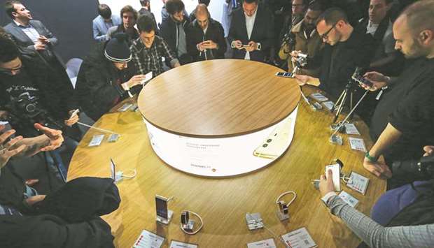 Attendees look at P9 smartphones, manufactured by Huawei Technologies Co, at its launch event in London on April 6, 2016. u201cFurther significant technical issues have been identified in Huaweiu2019s engineering processes, leading to new risks in the UK telecommunications networks,u201d read annual findings from the Huawei Cyber Security Evaluation Centre (HCSEC) oversight board yesterday.