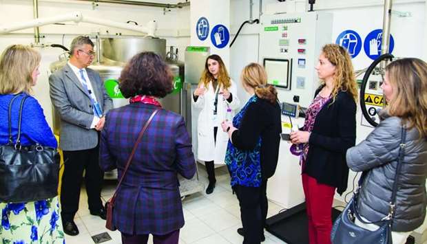 Biobanking conference delegates being briefed by a Qatar Biobank official.