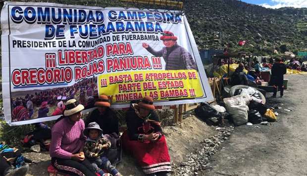 Demonstrators block a road access to a copper mine during a protest in Fuerabamba, Apurimac, Peru