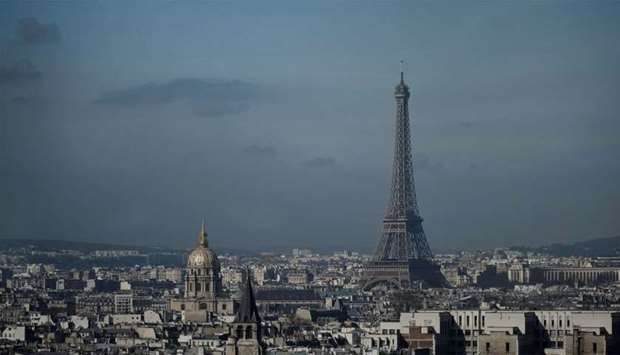 The Eiffel Tower and the dome of Les Invalides, are seen along the skyline of the French capital Paris from the tower at the Notre Dame Cathedral.