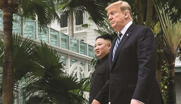 FILE PHOTO: US President Donald Trump (right) walks with North Koreau2019s leader Kim Jong-un during a break in talks at the second US-North Korea summit at the Sofitel Legend Metropole hotel in Hanoi.