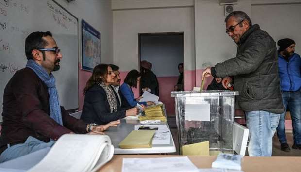 A man casts his vote at a polling station in Istanbul