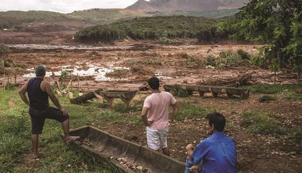 Residents survey damage after a Vale dam burst in Brumadinho, Minas Gerais state, Brazil in January. Over 300 people are believed to have died in the incident, making it the countryu2019s deadliest.