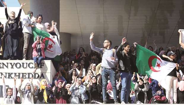 Students protest against Abdelaziz Bouteflikau2019s plan to extend his 20-year rule by seeking a fifth term in April elections, at a university in Algiers, yesterday.