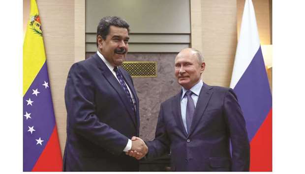 File photo of Russian President Vladimir Putin shaking hands with his Venezuelan counterpart Nicolas Maduro during a meeting at the Novo-Ogaryovo state residence outside Moscow, on December 5, 2018.