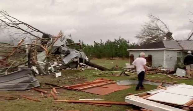 Debris of housing seen following a tornado in Beauregard, Alabama, US in this still image obtained from social media video.