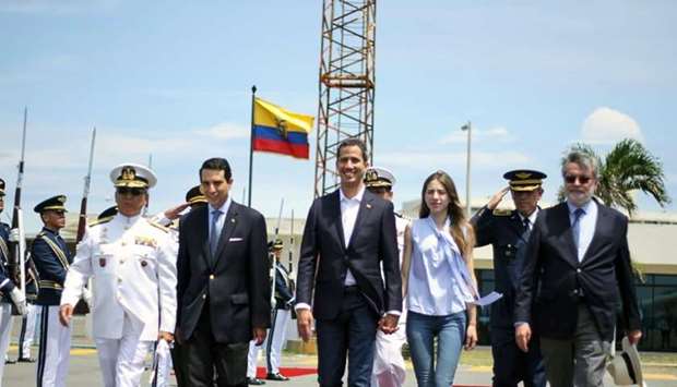Venezuelan opposition leader and self-proclaimed acting president Juan Guaido (C) and his wife Fabiana Rosales (C-R) receiving a presidential farewell before departing from the airport in Salinas, Ecuador yesterday,
