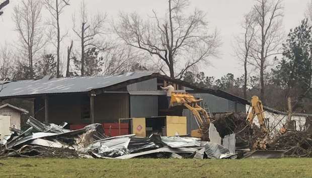 Debris are seen where two back-to-back tornadoes touched down in Lee County near Beauregard, Alabama, US