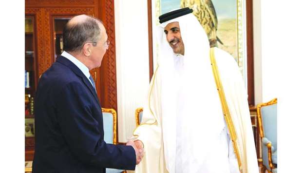 His Highness the Amir Sheikh Tamim bin Hamad al-Thani at his Amiri Diwan Office shakes hand with Russian Foreign Minister Sergey Lavrov.