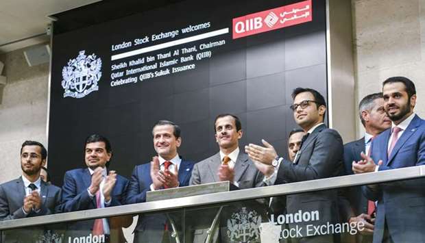 Sheikh Dr Khalid, Dr al-Shaibei with al-Khater, Penney and Sharma among other dignitaries during the listing of QIIB's $500mn sukuk on the London Stock Exchange.