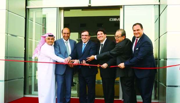 Top officials of Mannai Trading and General Motors led the ribbon-cutting ceremony of the new state-of-the-art GMC showroom in Qatar. PICTURES: Jayan Orma