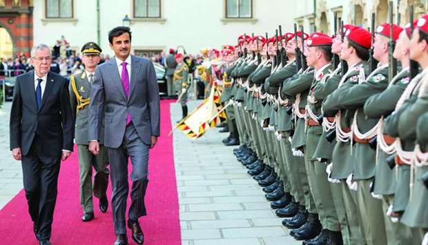 His Highness the Amir Sheikh Tamim bin Hamad al-Thani inspects a guard of honour with Austrian President Alexander Van der Bellen at Hofburg Presidential Palace in Vienna.