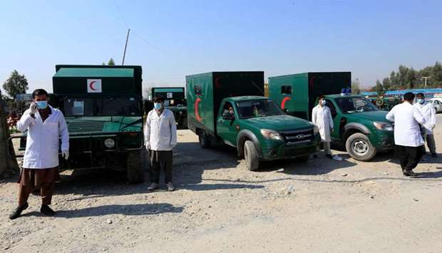Ambulances are parked while waiting to transfer the wounded near the site of an attack in Jalalabad