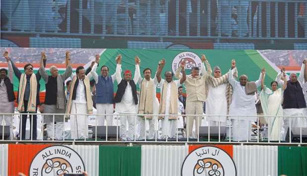 Leaders of India's main opposition parties join their hands together during ,United India, rally ahead of the general election, in Kolkata