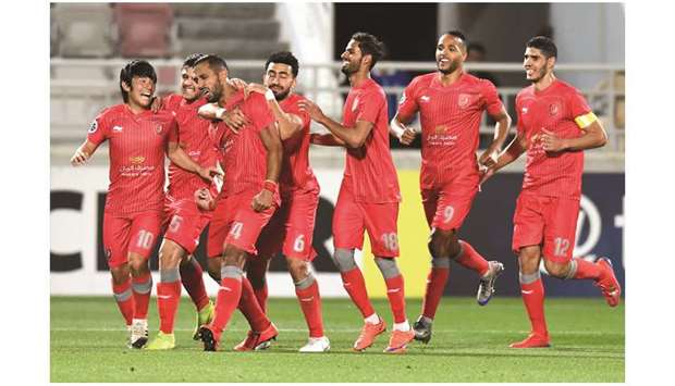 Medhi Benatia (third from left) reacts as his Al Duhail colleagues congratulate him after he scored against Esteghlal in their opening Asian Champions League match yesterday. PICTURE:  Noushad Thekkayil