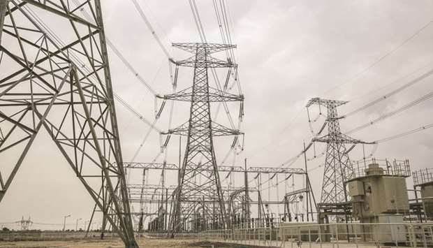 Power lines hang from transmission pylons at the Sahiwal coal power plant in Sahiwal, Punjab, Pakistan (file). The government of Prime Minister Imran Khan is trying to clear power sector government payment arrears amid warnings by power producers that they could go out of business if they are not paid.
