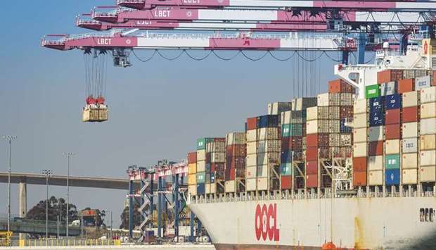 A gantry crane unloads containers from a cargo ship at the Long Beach Container Terminal in California. The US trade deficit surged to a 10-year high in 2018, with the  politically sensitive shortfall with China hitting a record peak, despite the Trump administration slapping tariffs on a range of imported goods in an effort to shrink the gap.
