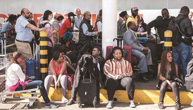 Passengers are blocked from entering Kenya Airwaysu2019s departure terminal due to a strike by the airline workers at the Jomo Kenyatta International Airport in Nairobi, yesterday.