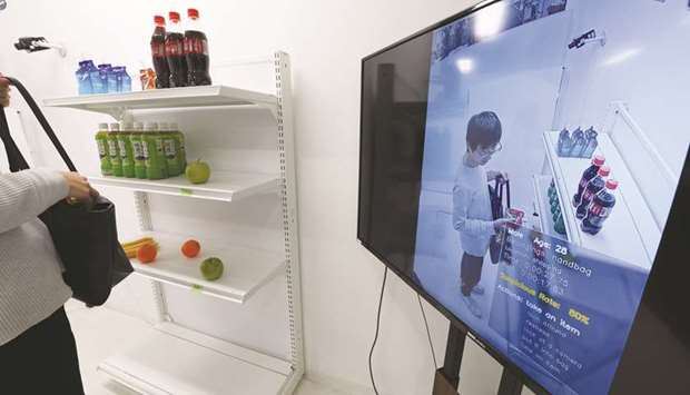 A screen displays a Vaak employee handling a product in a mock store while demonstrating the companyu2019s shoplifting-detection system in Tokyo. Vaak, a Japanese startup, has developed artificial intelligence software that hunts for potential  shoplifters, using footage from security cameras for fidgeting, restlessness and other potentially suspicious body language.