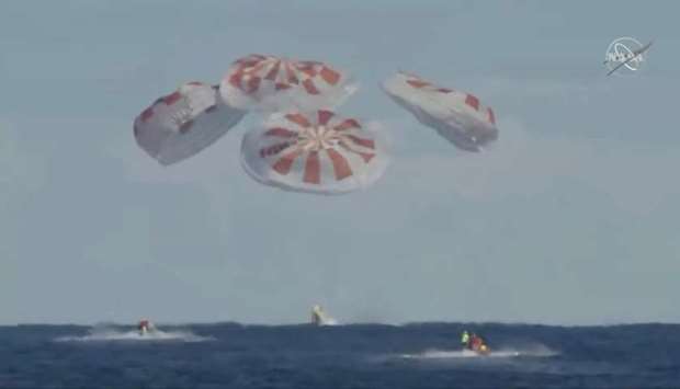 An unmanned capsule of the SpaceX Crew Dragon spacecraft splashes down into the Atlantic Ocean, after a short-term stay on the International Space Station, in this still image from video, in the Atlantic, about 200 miles off the Florida coast, US. Courtesy NASA/Handout via REUTERS