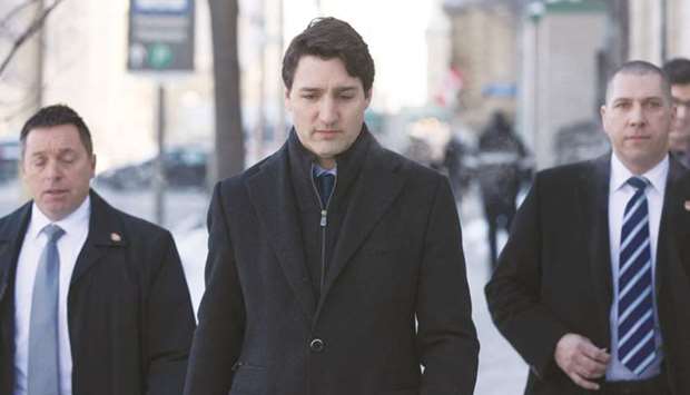 Canadian Prime Minister Justin Trudeau walks to a press conference from the Prime Ministeru2019s office in Ottawa, Ontario, yesterday. Trudeau yesterday denied allegations of u201cpartisanu201d political meddling in the criminal prosecution of a corporate giant that have plunged his Liberal government into its worst crisis yet.