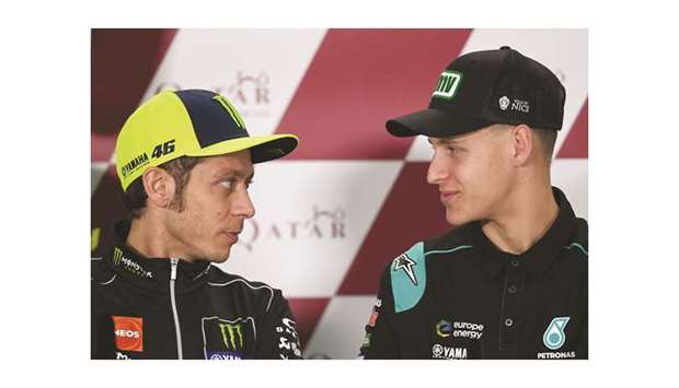 Yamaha MotoGPu2019s Valentino Rossi of Italy (L) and Petronas Yamaha SRTu2019s Fabio Quartararo attend a press conference at Losail International Circuit. The 19-year-old Quartararo is 21 years younger than Rossi, who turned 40 last month.