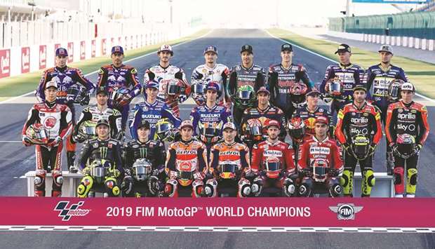 ALL SET:  MotoGP riders pose for a group photo ahead of the start of the new season at Losail International Circuit yesterday.
