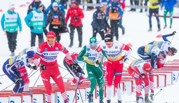 Alexander Bolshunov (Front) of Russia competes during the mens's 50 km C Mst event at the FIS Cross Country World Cup in Holmenkollen