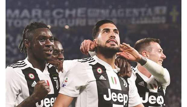 Juventusu2019 midfielder Emre Can (centre) celebrates with forwards Moise Kean (left) and Federico Bernardeschi after scoring during their Serie A match against Udinese at the Juventus Allianz stadium in Turin. (AFP)