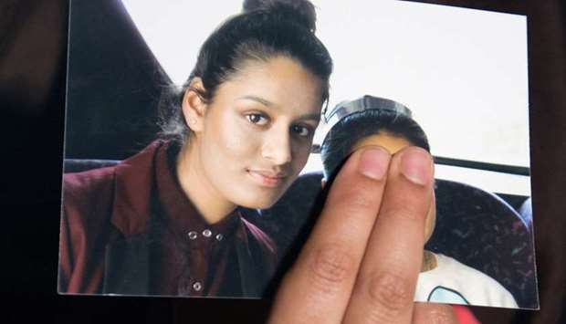 Renu Begum, sister of teenage British girl Shamima Begum, holds a photo of her sister as she makes an appeal for her to return home at Scotland Yard, in London, Britain February 22, 2015. Reuters