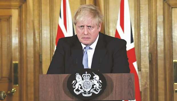 Prime Minister Boris Johnson attends a news conference on coronavirus at Downing Street in London, Britain, yesterday.