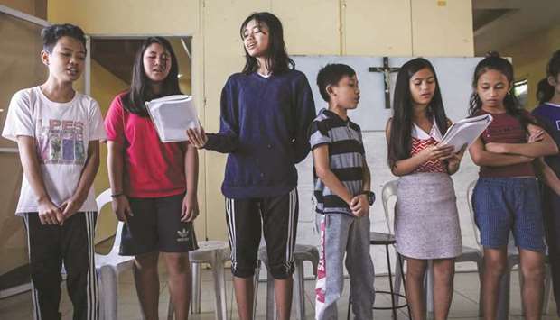 In this photo taken on February 1, 2020, children u2014 including those who have lost a parent in alleged extrajudicial killings u2014 attend a choir session as part of the Project Support Orphans and Widows (SOW) rehabilitation programme in Payatas, Quezon City in suburban Manila.