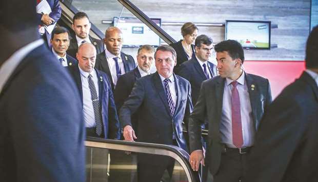 Brazilian President Jair Bolsonaro leaves the Forum Of The Americas at the InterContinental Miami in Miami, Florida, yesterday.