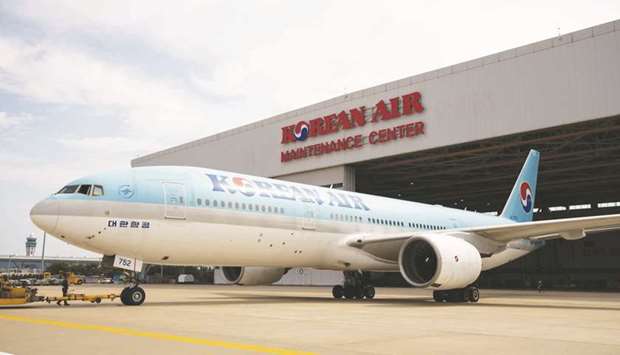 A Boeing 777-200 passenger aircraft operated by Korean Air Lines Co arrives at a maintenance centre at Incheon International Airport in South Korea. The airline warned yesterday that the virus outbreak could threaten its survival after it scrapped more than 80% of its international capacity, grounding 100 of its 145 passenger aircraft.