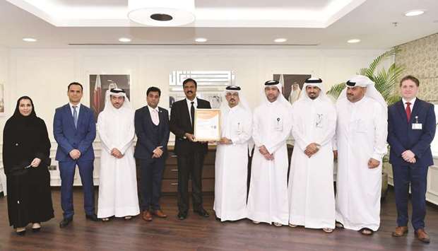 Ashghalu2019s engineer Jamal Sharida al-Kaabi receiving the award in the presence of other officials.