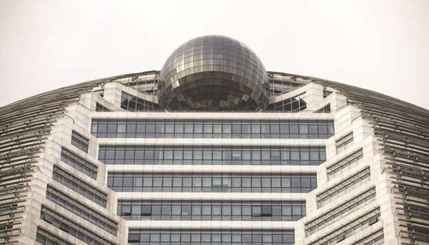 The HNA Group headquarters building stands in Haikou, China. The country took over management of debt-laden HNA Groupu2019s liquidity risks after the coronavirus outbreak scared off travellers and cut off the conglomerateu2019s main source of income, forcing the government to take extraordinary steps to contain the fallout from the epidemic.