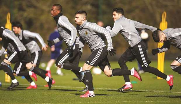 Wolverhampton Wanderers players train on the eve of their Europa League game against Olympiakos yesterday. The match will be played behind closed doors. (Reuters)