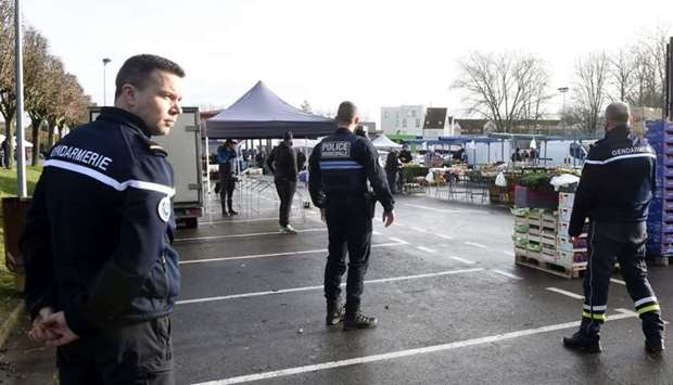 French police and gendarme officers evacuate the market of Crepy-in-Valois on March 1, 2020, following the outbreak of the novel coronavirus, Covid-19