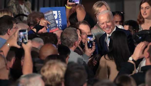 Democratic presidential candidate former Vice President Joe Biden celebrates with his supporters after declaring victory at an election-night rally at the University of South Carolina Volleyball Center
