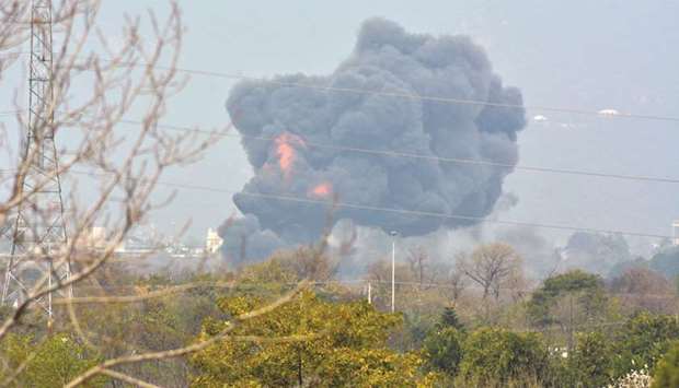 Smoke billows from the scene where a Pakistan Air Force F-16 fighter jet crashed in Islamabad, yesterday.