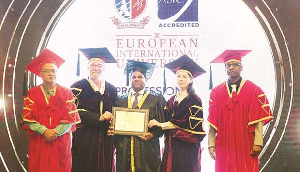 LuLu Hypermarkets director Mohamed Althaf (centre) receiving a doctorate in Global Leadership & Management from the European International University, Paris.